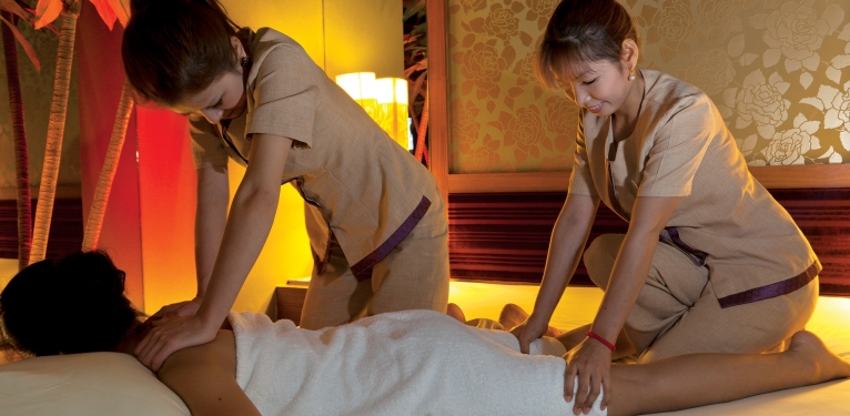Hot herbal compress massage4 hands Ancient Cambodian Spa Therapy. 